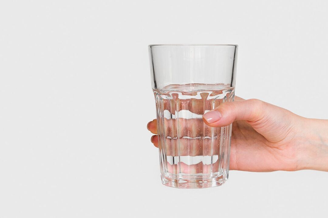 A glass of water with diluted powder Keto Probiotix